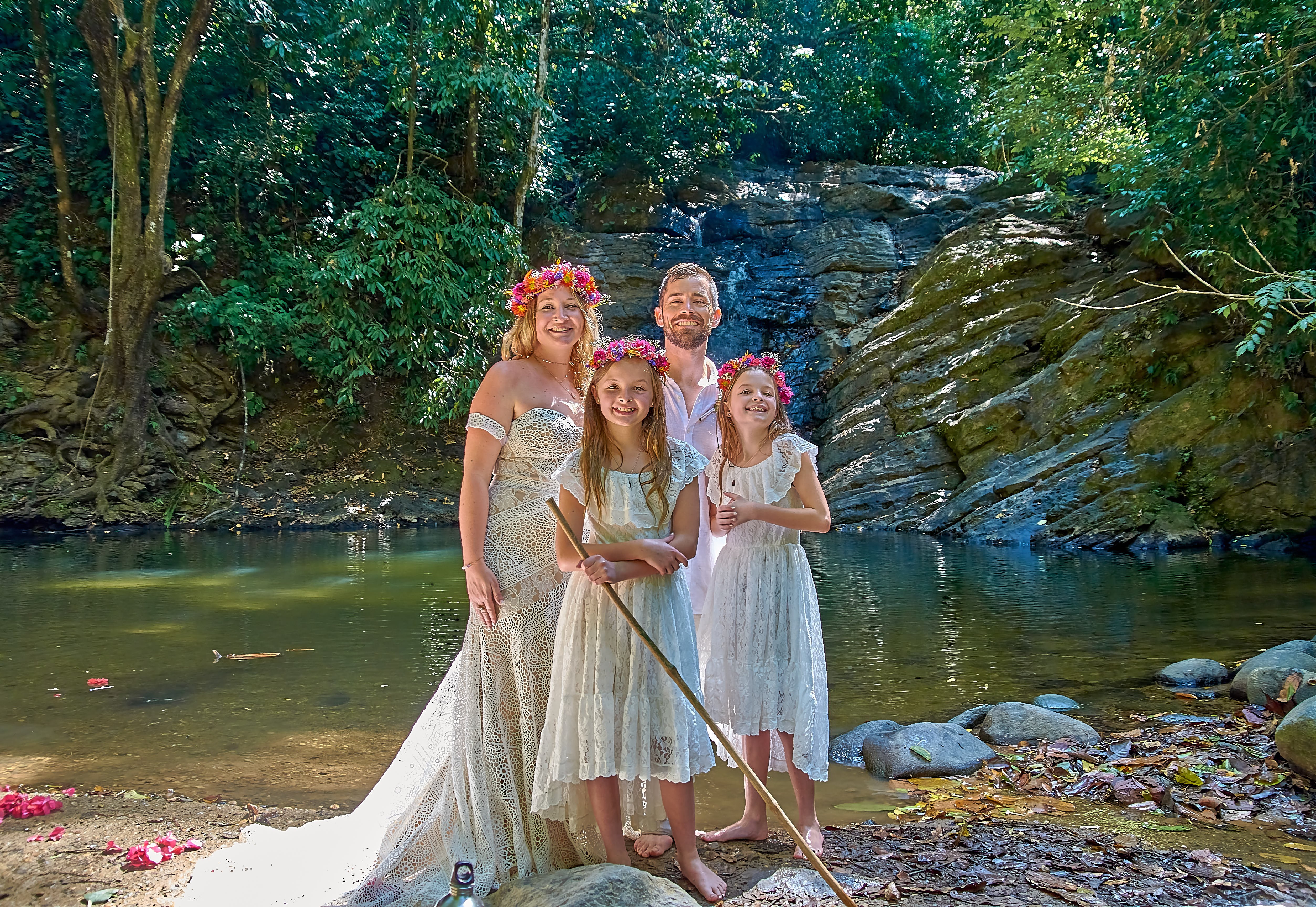 Romance blooms amidst the lush greenery of Uvita's tropical jungle, where love takes center stage in this magical wedding moment.